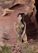 Transsexual beauty Mia strips in the cave